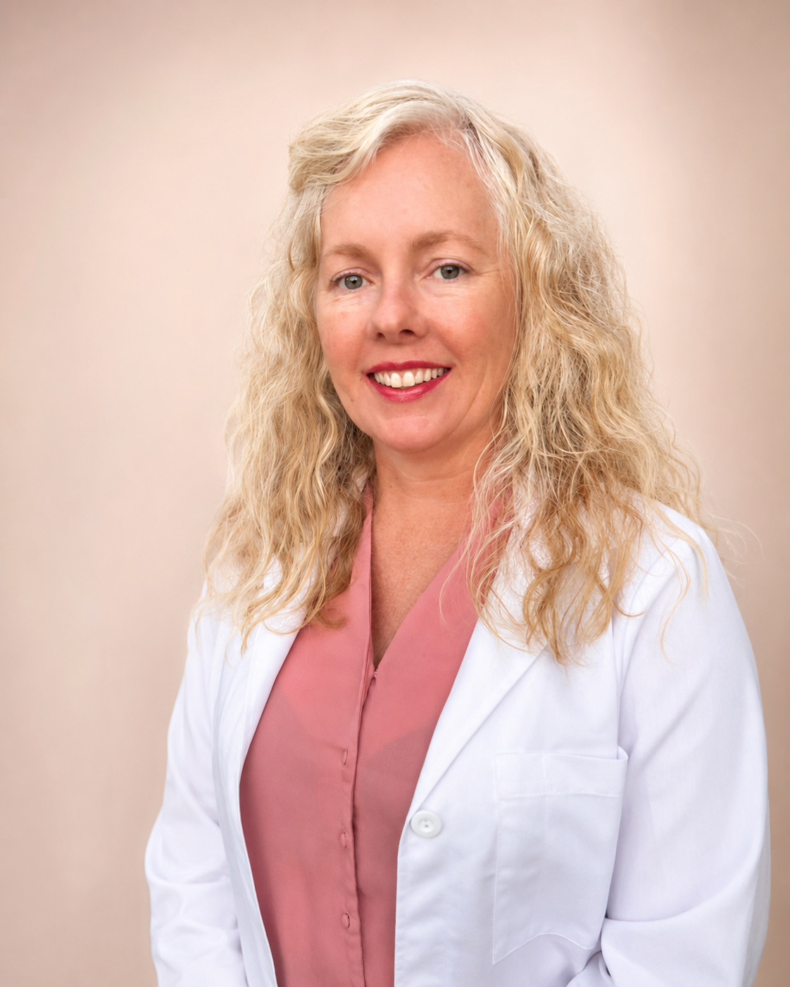 Dr. Andrea McSwain, DO, in a white clinical coat